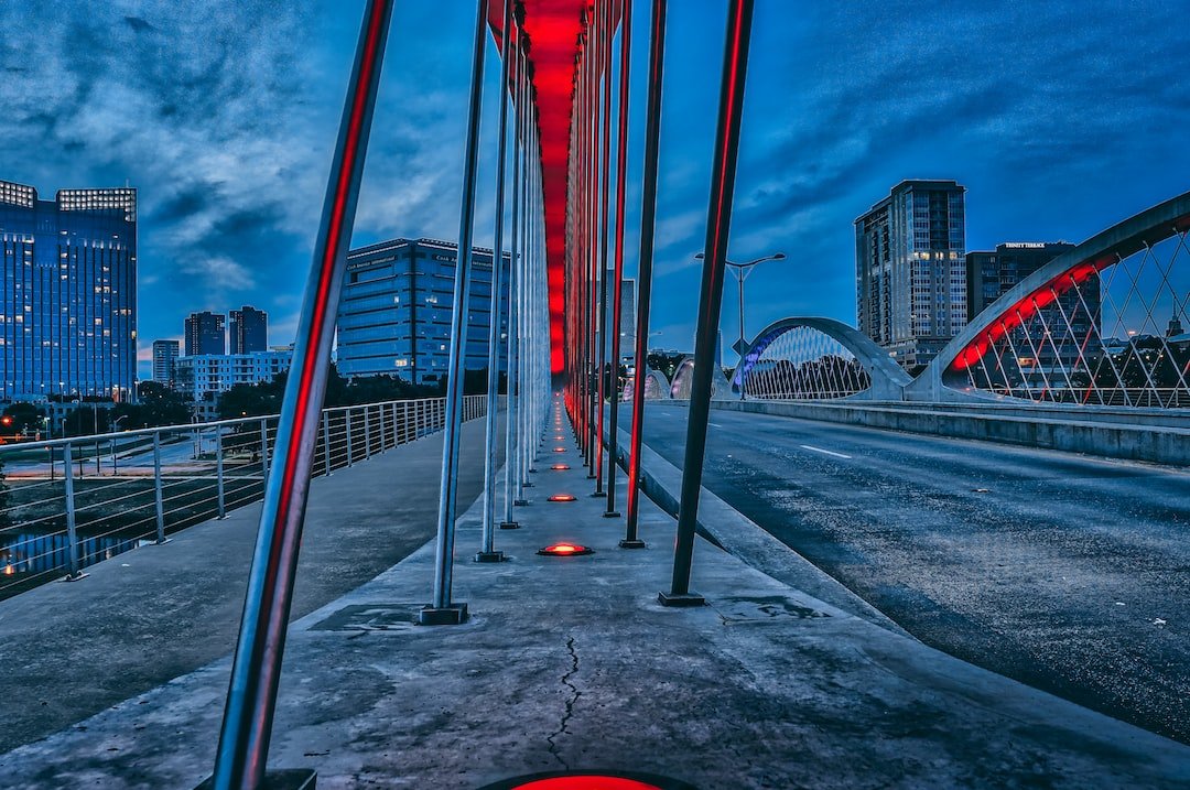 bridge with red lights during nighttime
