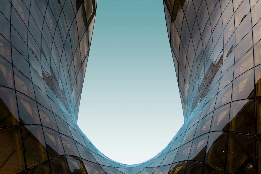 glass high rise building under blue sky